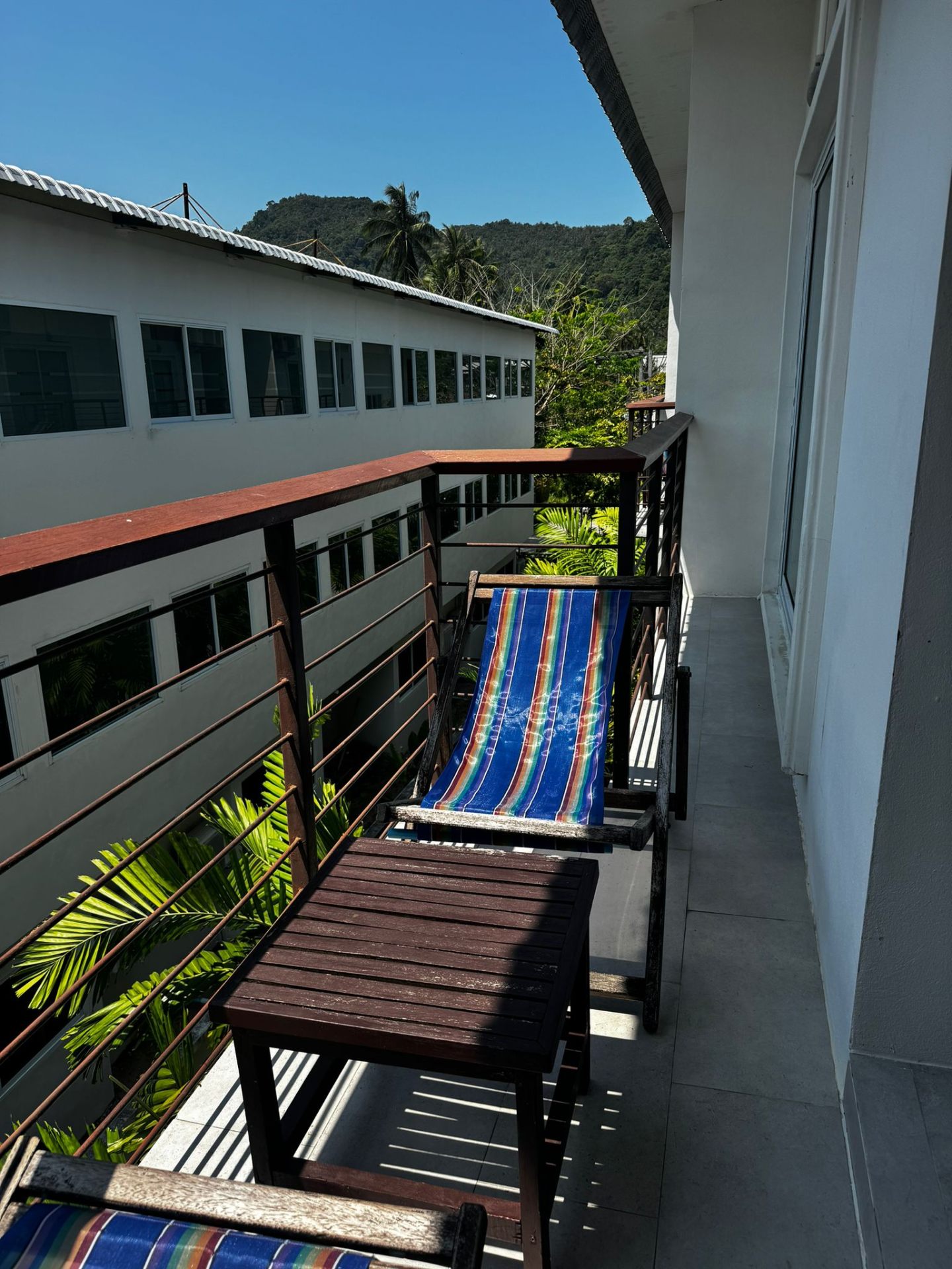 Private balcony with sun loungers and jungle views